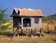 Cambodia: A blue-painted stilt house on Cambodia's central plains, a common sight all across the country